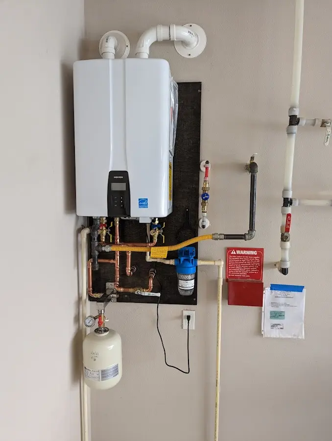 Professional plumber installing copper piping in a Orleans home