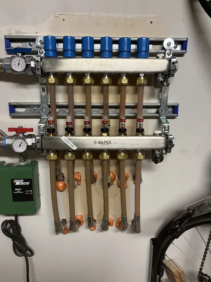 Plumber performing Water Heater Repair at a residential property in Orleans